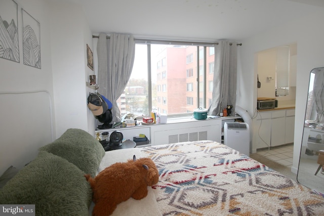 bedroom featuring light carpet