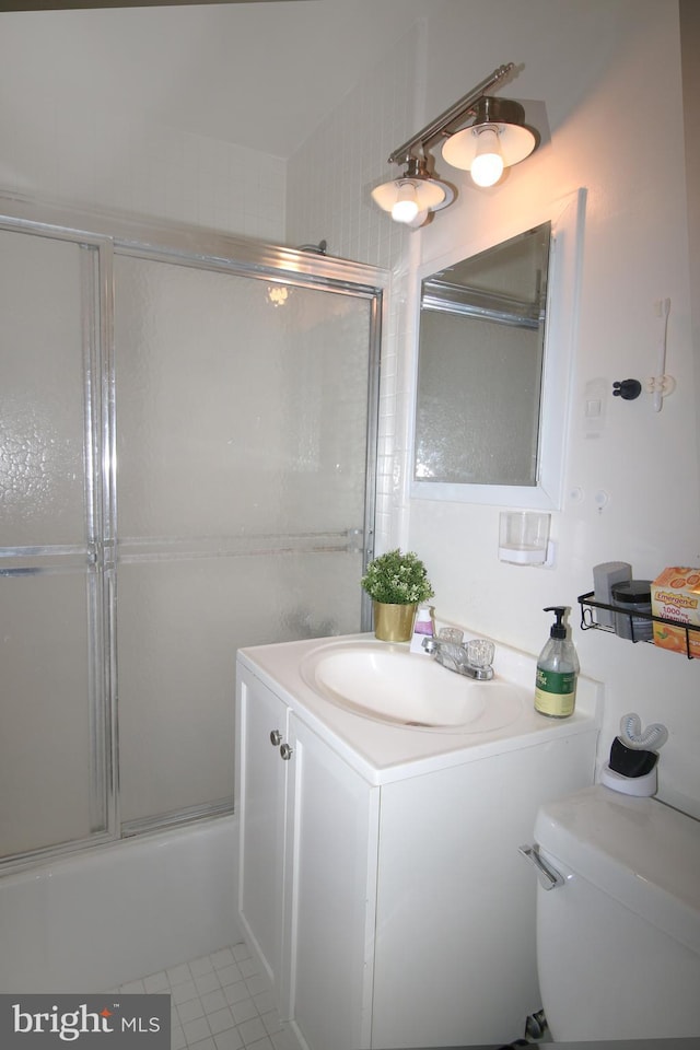 1121 Arlington Blvd Unit 703, Arlington, VA 22209 - full bath with toilet, vanity, combined bath / shower with glass door, and tile patterned flooring