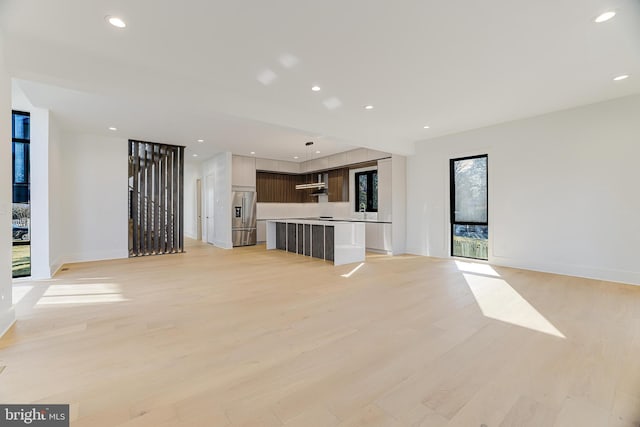 unfurnished living room with light hardwood / wood-style flooring