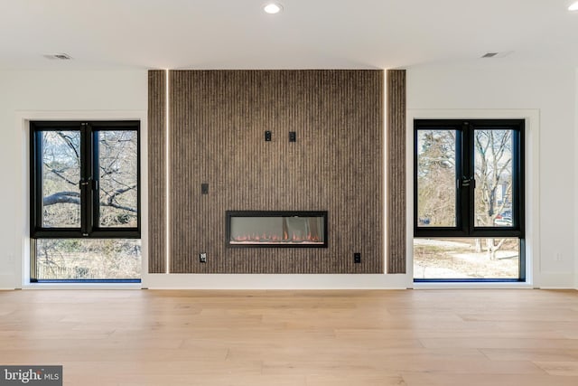 unfurnished living room featuring light wood-type flooring