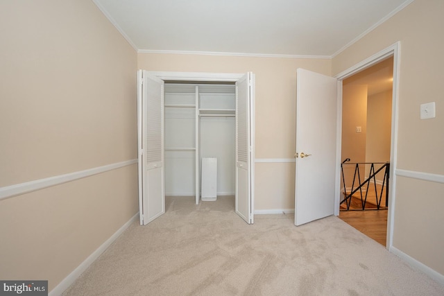 unfurnished bedroom with light carpet, a closet, and ornamental molding