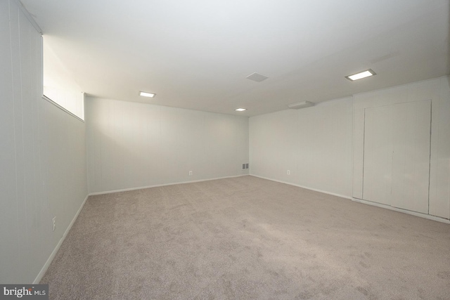 empty room featuring light carpet