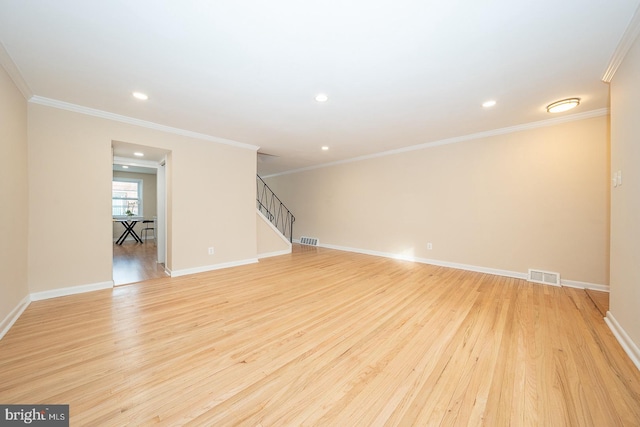 interior space with light hardwood / wood-style flooring and ornamental molding