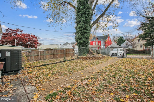 view of yard with central AC unit