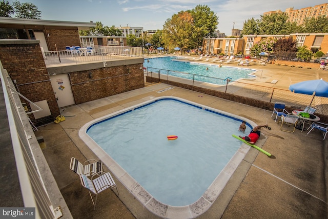 view of pool with a patio area