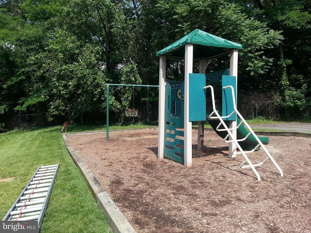 view of jungle gym with a lawn