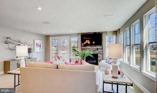 living room featuring a large fireplace