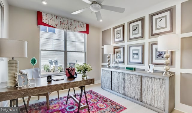 office with a wealth of natural light and ceiling fan