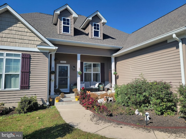 doorway to property featuring covered porch