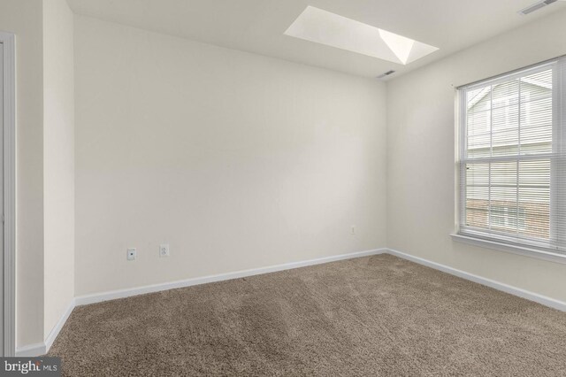 3121 W Thompson St, Philadelphia, PA 19121 - carpeted empty room featuring a skylight, healthy amount of natural light, and baseboards