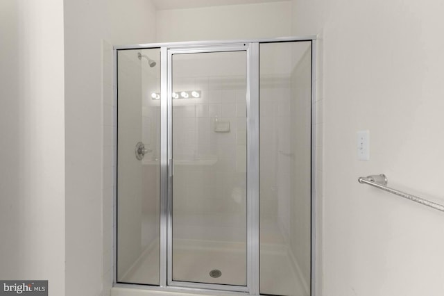 bathroom featuring an enclosed shower