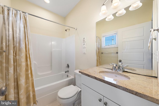 full bathroom featuring shower / bath combo, vanity, and toilet