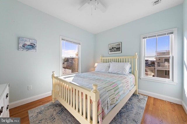 bedroom featuring hardwood / wood-style flooring and ceiling fan