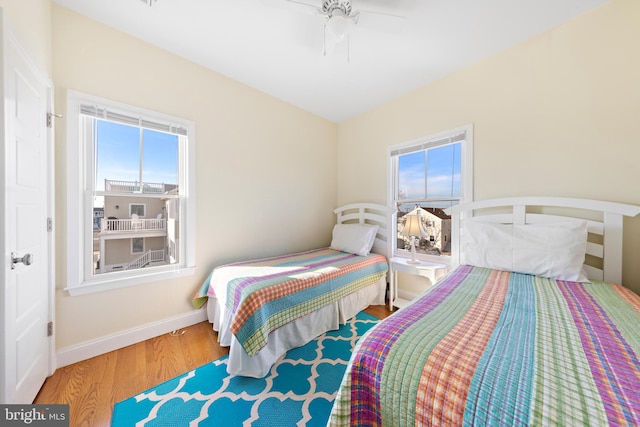 bedroom with hardwood / wood-style floors and ceiling fan