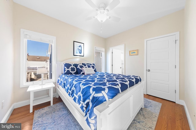 bedroom featuring wood-type flooring and ceiling fan