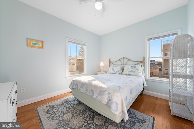 bedroom featuring hardwood / wood-style flooring and ceiling fan