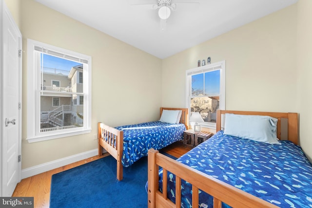 bedroom with wood-type flooring and ceiling fan