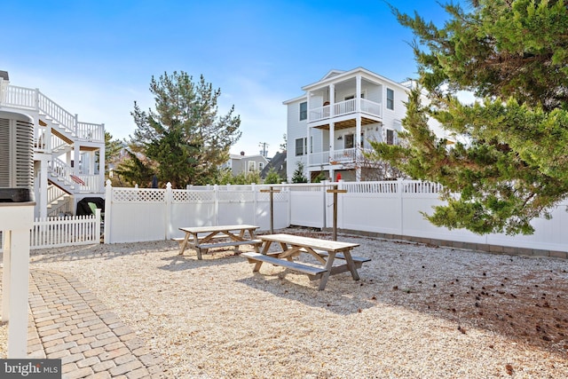 220 Taylor Ave, Beach Haven, NJ 08008 - fenced backyard featuring stairway and a balcony