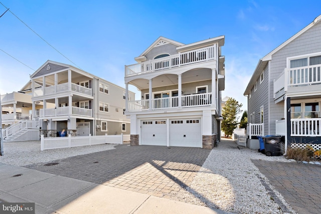 raised beach house featuring a garage