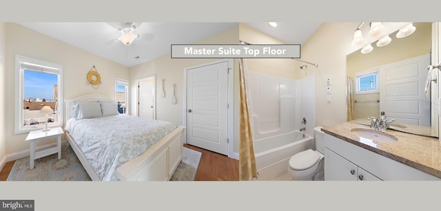 bedroom with ceiling fan, sink, light hardwood / wood-style floors, and lofted ceiling