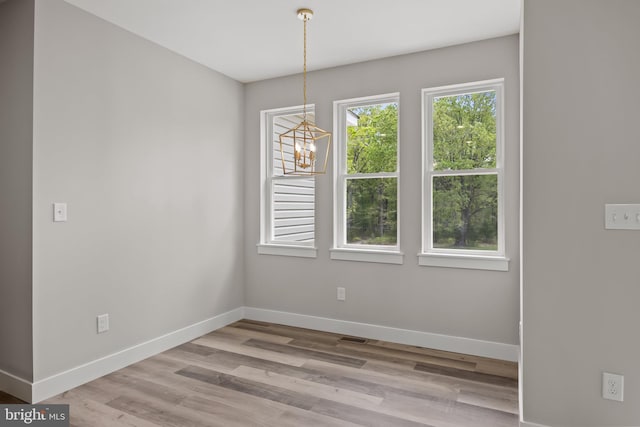 4540 Lake Rd, Newfield, NJ 08344 - unfurnished dining area with baseboards, a chandelier, and wood finished floors