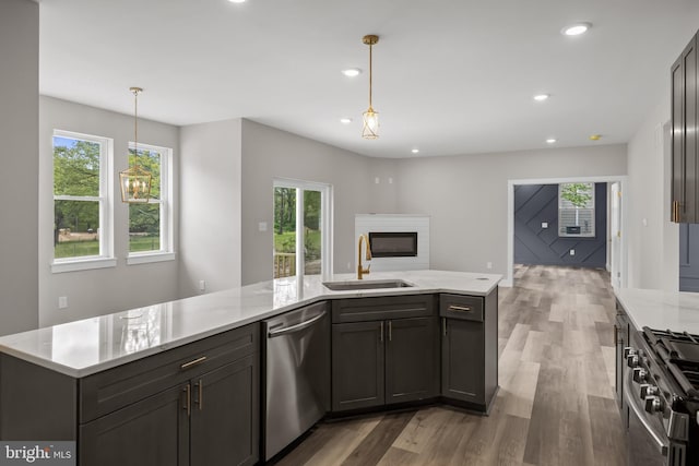 4540 Lake Rd, Newfield, NJ 08344 - kitchen with appliances with stainless steel finishes, a sink, wood finished floors, healthy amount of natural light, and recessed lighting