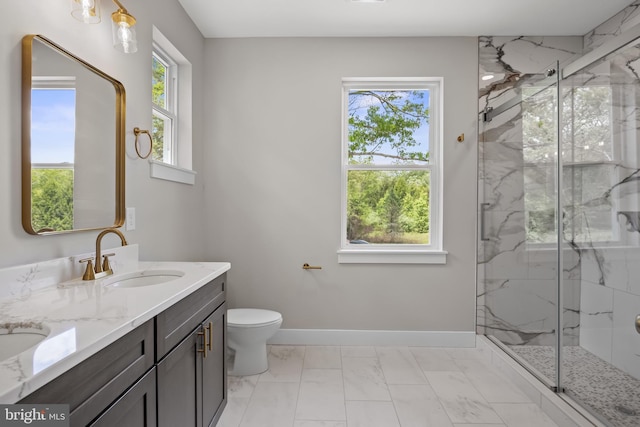 4540 Lake Rd, Newfield, NJ 08344 - full bathroom with marble finish flooring, a marble finish shower, double vanity, toilet, and baseboards