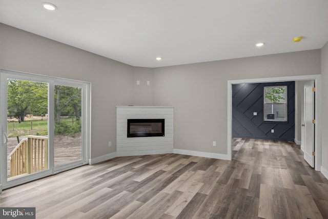 4540 Lake Rd, Newfield, NJ 08344 - unfurnished living room featuring wood finished floors, plenty of natural light, baseboards, and recessed lighting
