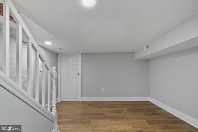 basement with wood-type flooring