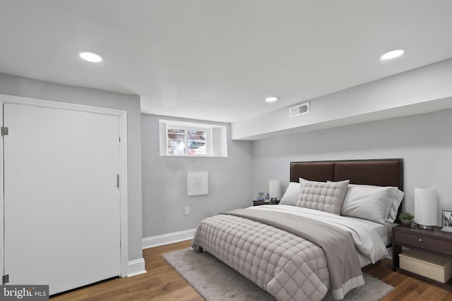 bedroom featuring dark wood-type flooring