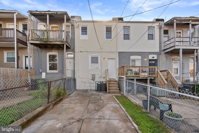 rear view of property with central air condition unit