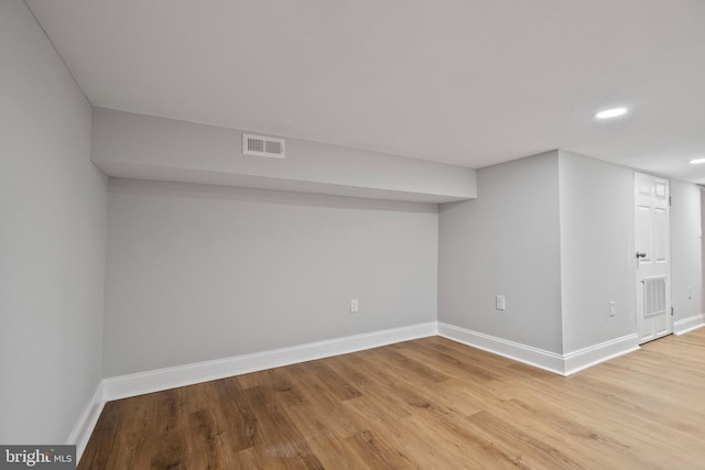 basement featuring light wood-type flooring