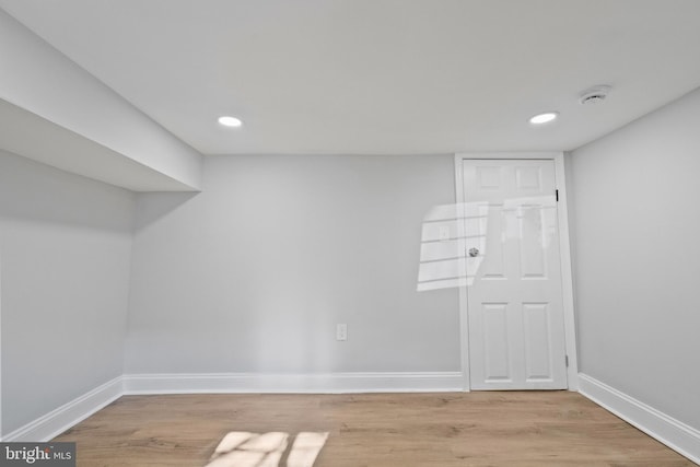 basement featuring light hardwood / wood-style flooring