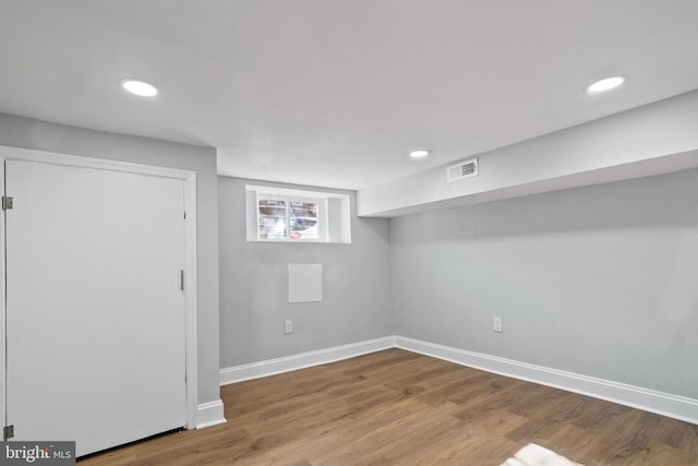 basement featuring hardwood / wood-style flooring