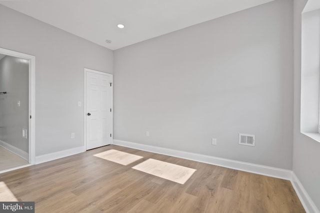 unfurnished room featuring light wood-type flooring