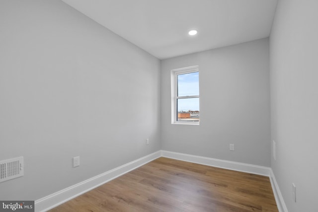 unfurnished room featuring light hardwood / wood-style floors