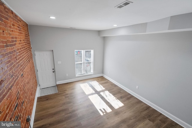 empty room featuring dark hardwood / wood-style flooring