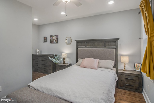 bedroom featuring dark hardwood / wood-style flooring and ceiling fan