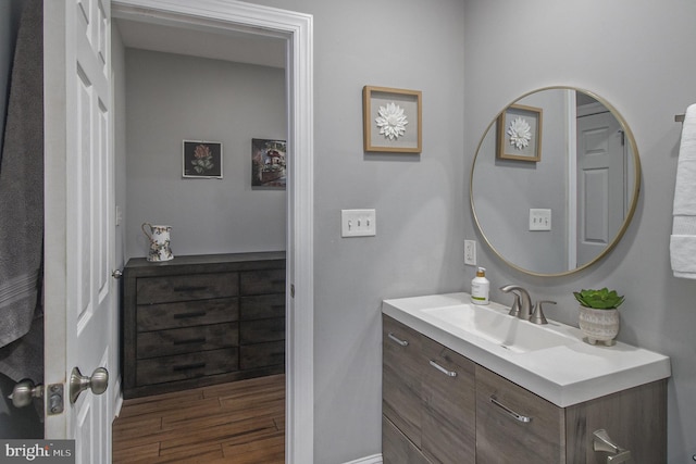 bathroom featuring vanity and hardwood / wood-style flooring