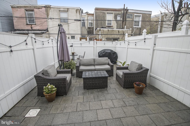 view of patio featuring an outdoor living space and grilling area