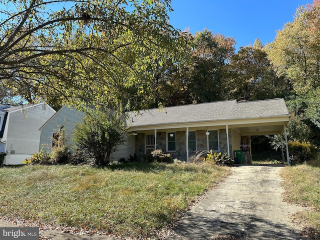 ranch-style home featuring a carport