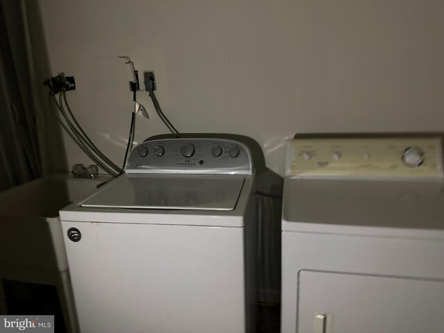 laundry room with separate washer and dryer