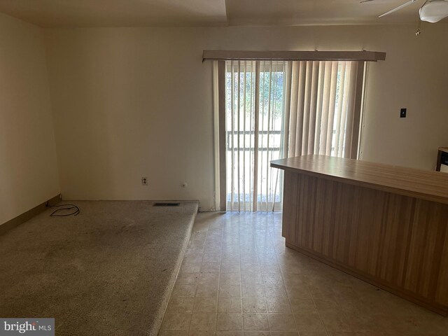 unfurnished room featuring ceiling fan