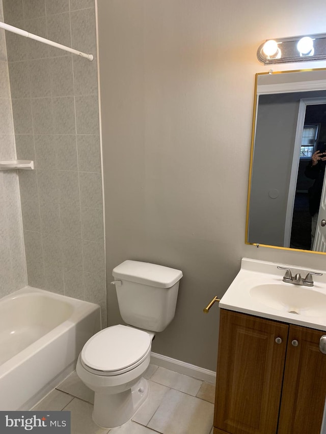 full bathroom featuring tile patterned flooring, vanity, toilet, and tiled shower / bath