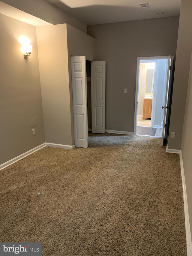 unfurnished bedroom with carpet flooring