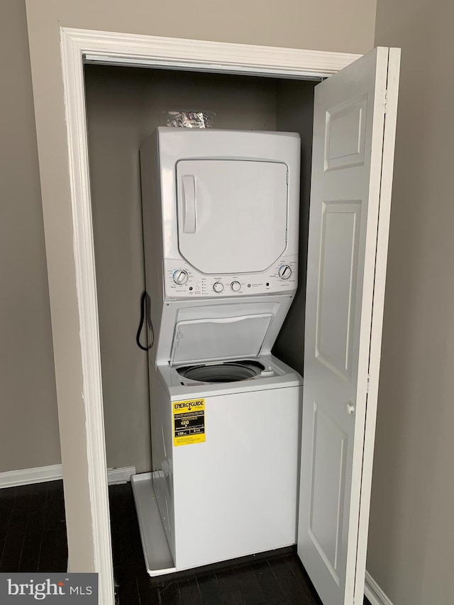 laundry room featuring stacked washer / dryer