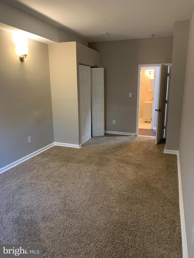 unfurnished bedroom with carpet