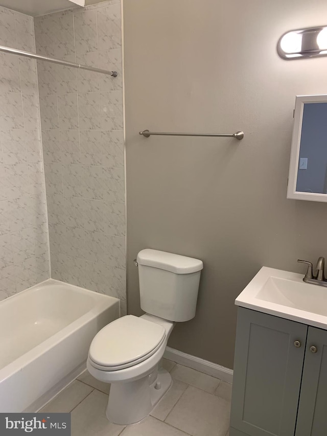 full bathroom featuring tile patterned floors, bathing tub / shower combination, vanity, and toilet