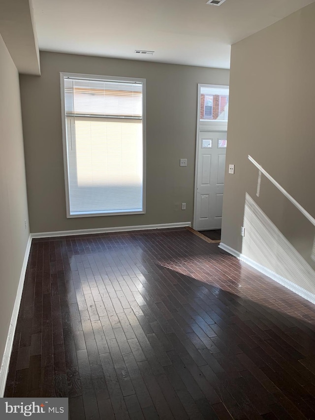 foyer with dark hardwood / wood-style flooring