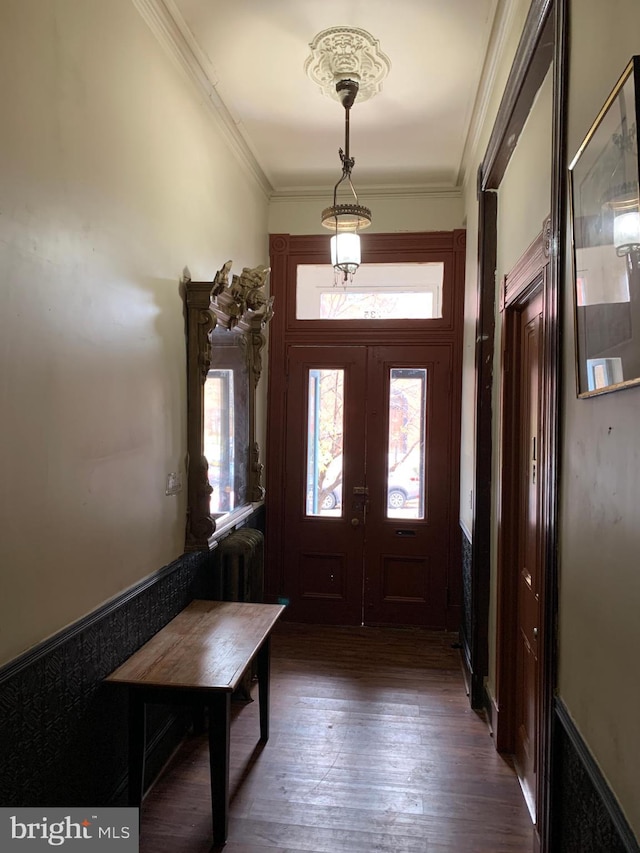 entryway featuring dark hardwood / wood-style floors, ornamental molding, and french doors